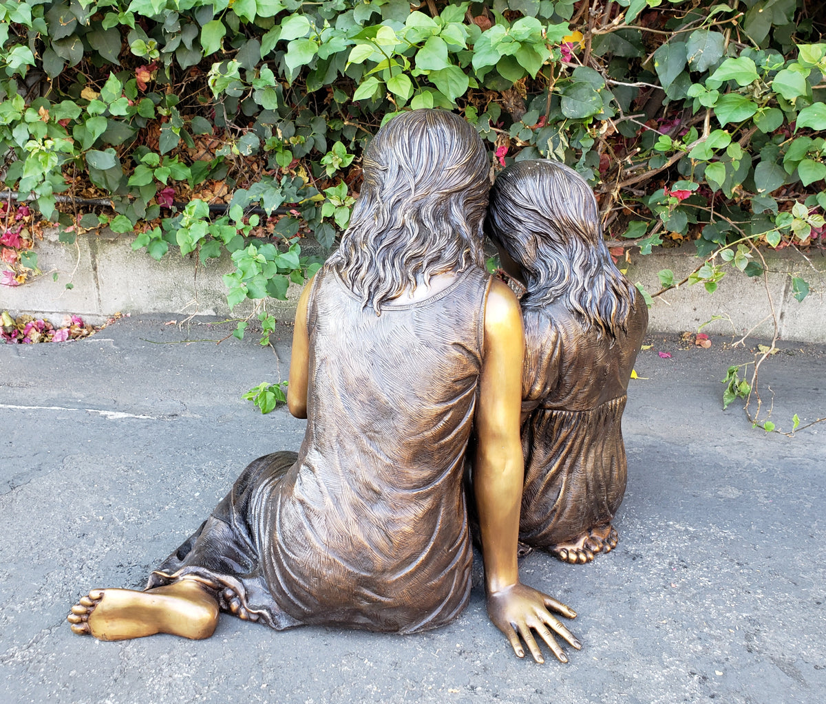 TWO GIRLS READING BOOK CAST IN BRONZE