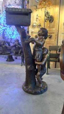 BOY AND GIRL CLIMBING A MAILBOX (CAST IN BRONZE)