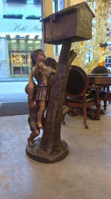 BOY AND GIRL CLIMBING A MAILBOX (CAST IN BRONZE)
