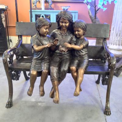 THREE CHILDREN ON A BENCH